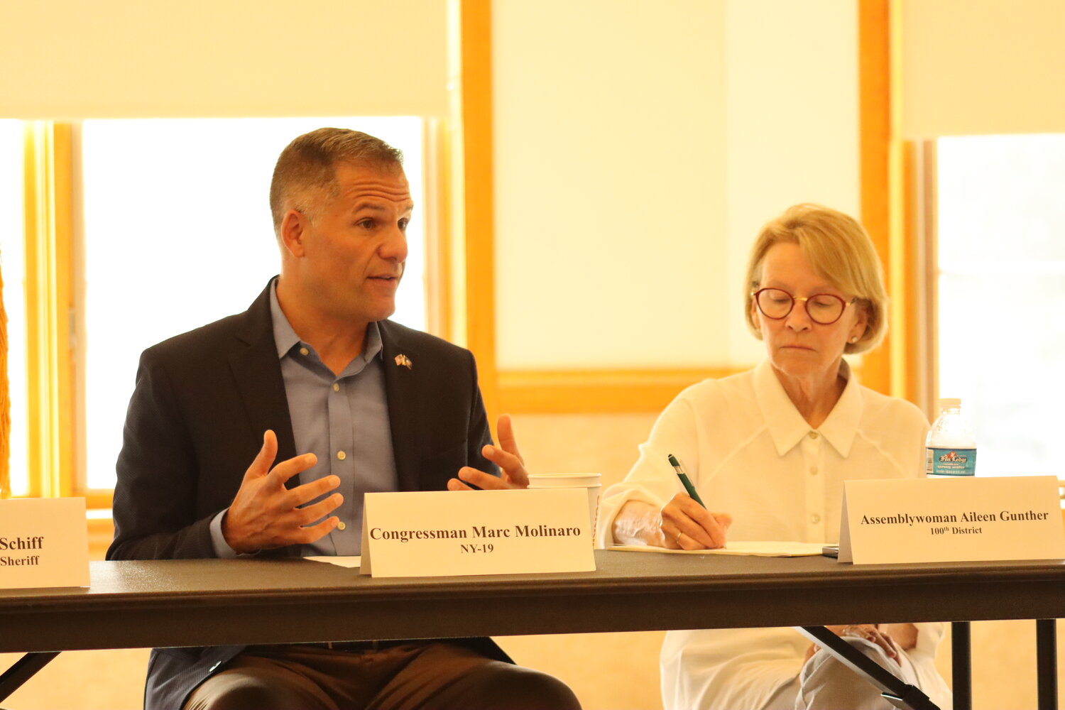 Representative Marc Molinaro, left, hosts a roundtable to discuss opioid crisis solutions on September 5. Assemblywoman Aileen Gunther is in attendance as well as other stakeholders who are working on the problem.